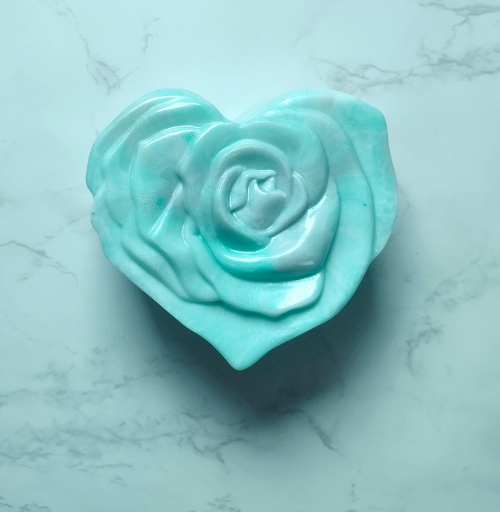 Decorative rose-shaped resin jar used for storage or display